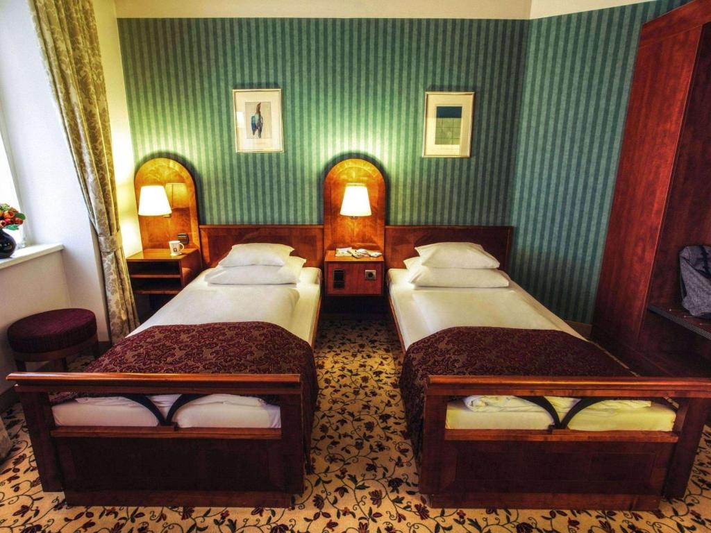 Postel nebo postele na pokoji v ubytování Mercure Grand Hotel Biedermeier Wien