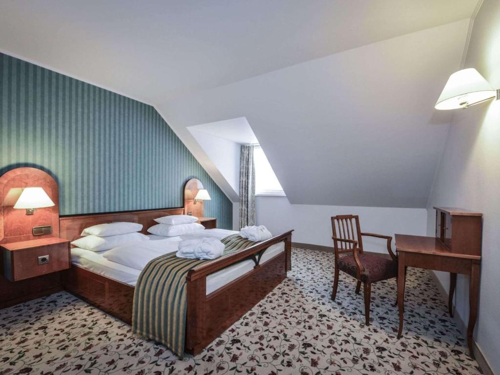 Postel nebo postele na pokoji v ubytování Mercure Grand Hotel Biedermeier Wien