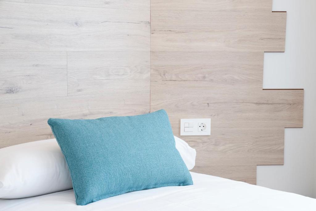 Posteľ alebo postele v izbe v ubytovaní Hotel VIDA Finisterre Centro