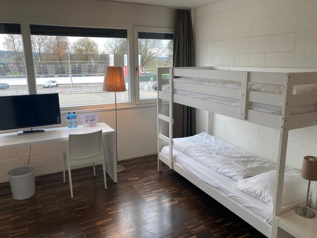 Una cama o camas en una habitación de Omnium Sport Hotel