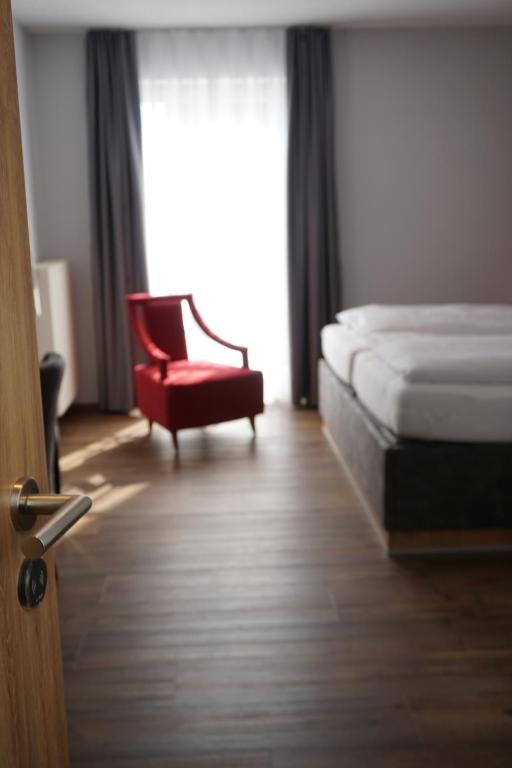 Postel nebo postele na pokoji v ubytování Hotel Grüner Baum