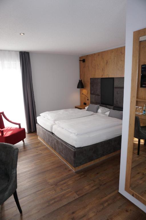 Postel nebo postele na pokoji v ubytování Hotel Grüner Baum