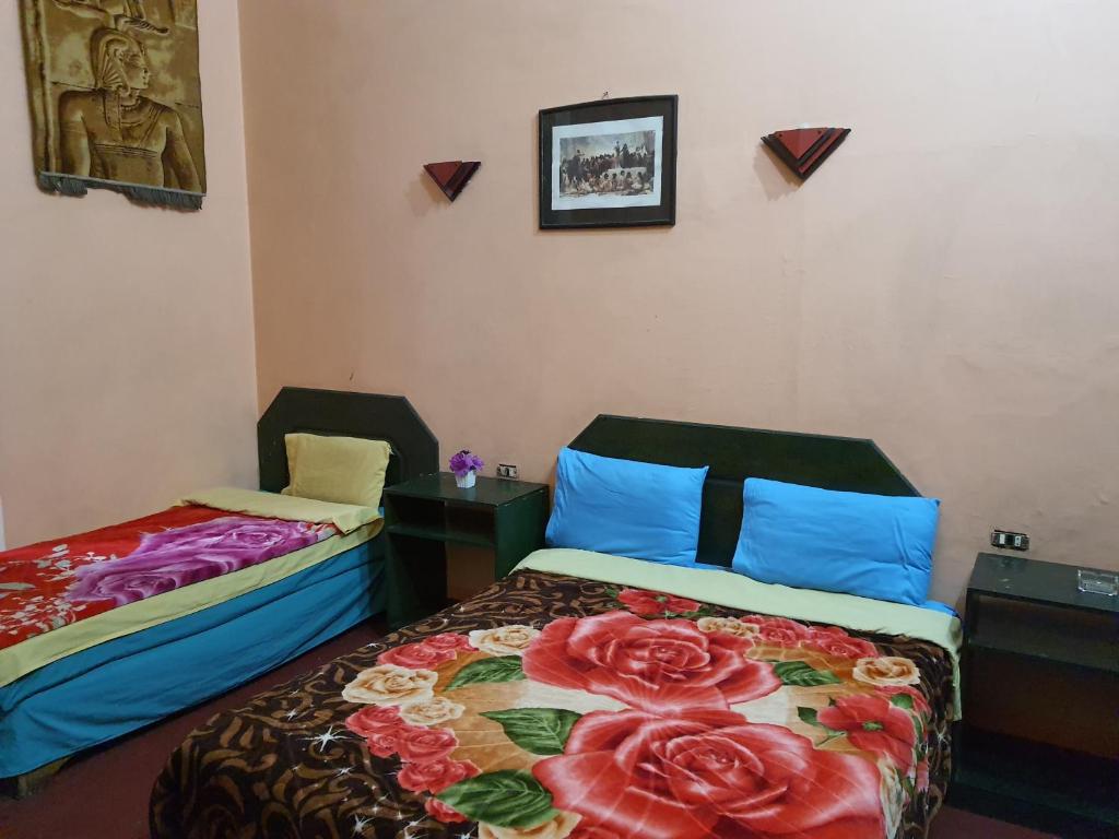 Postel nebo postele na pokoji v ubytování African House Hostel