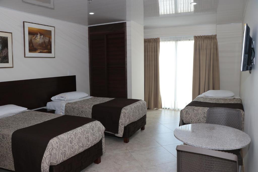 Postel nebo postele na pokoji v ubytování Hotel Castellana Group