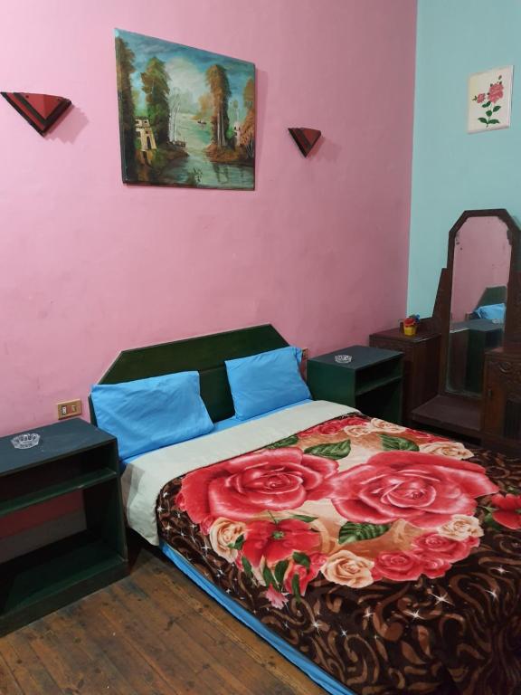 Postel nebo postele na pokoji v ubytování African House Hostel