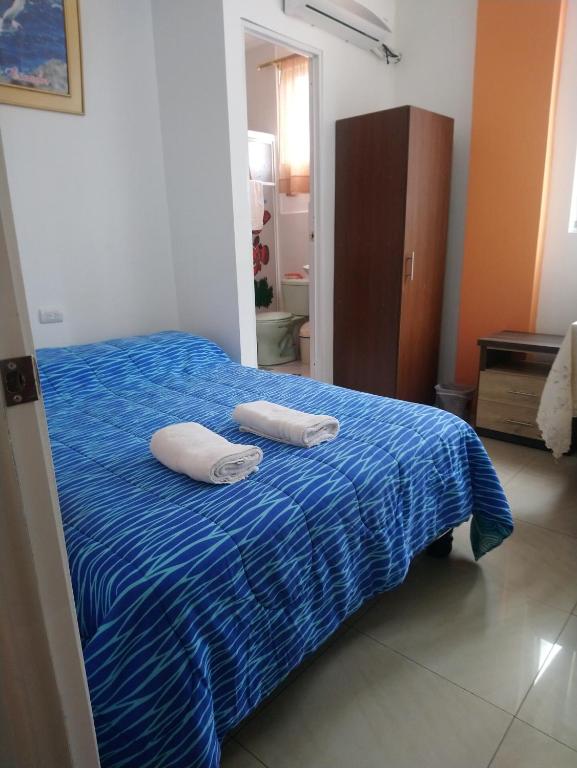 Postel nebo postele na pokoji v ubytování Hostal Terito