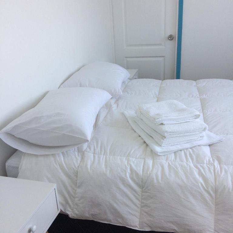 Postel nebo postele na pokoji v ubytování Bahía Luz Hostal
