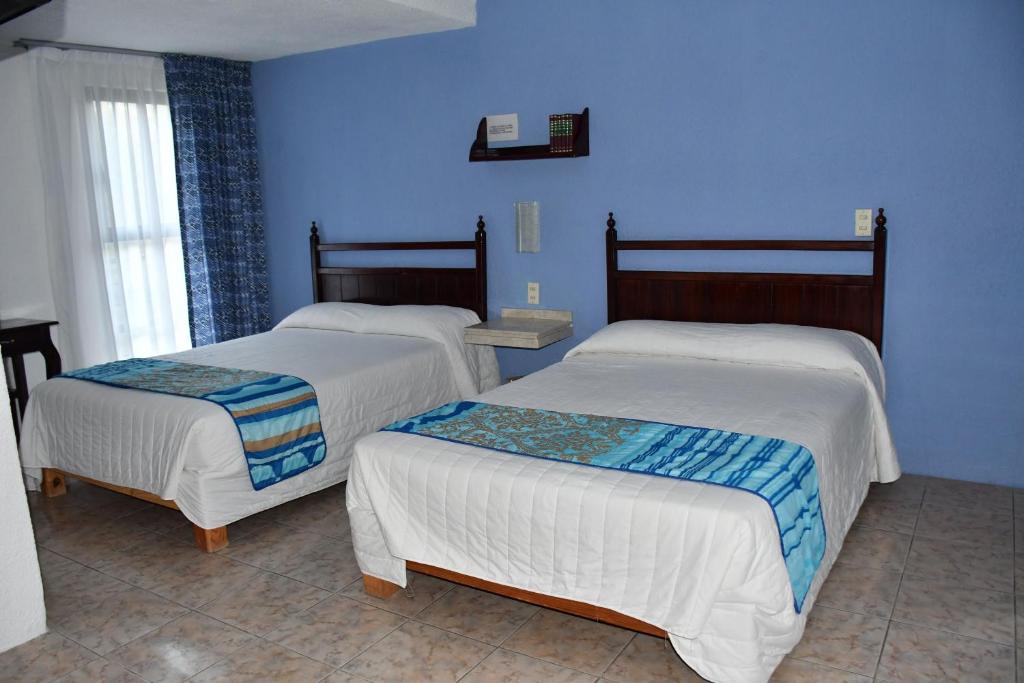 Postel nebo postele na pokoji v ubytování Hotel Posada Santa Fe