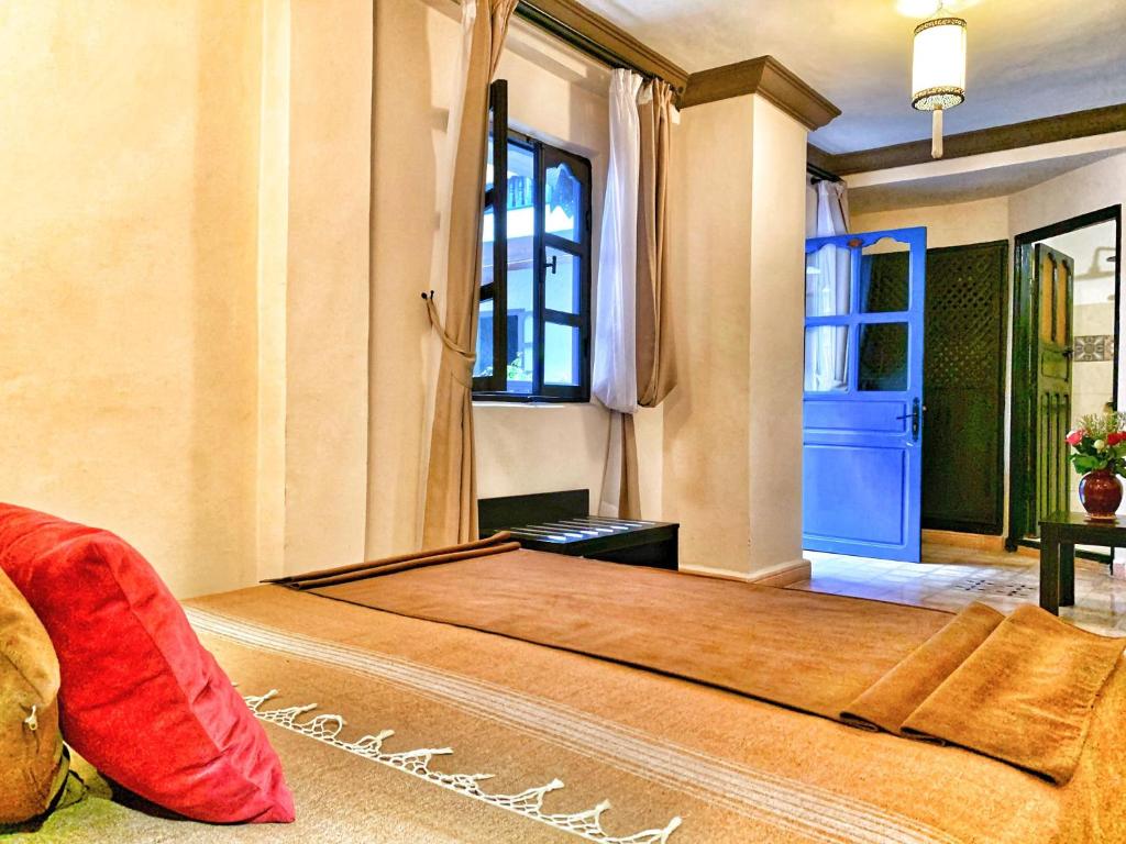 Postel nebo postele na pokoji v ubytování Riad Al Madina