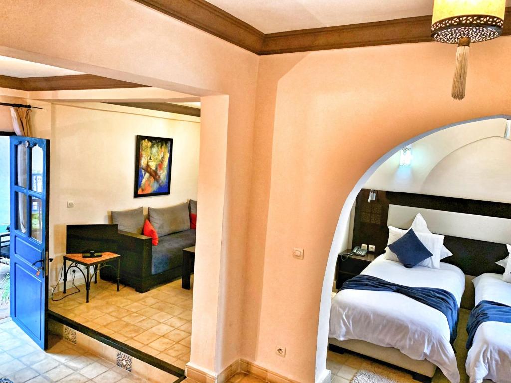 Postel nebo postele na pokoji v ubytování Riad Al Madina