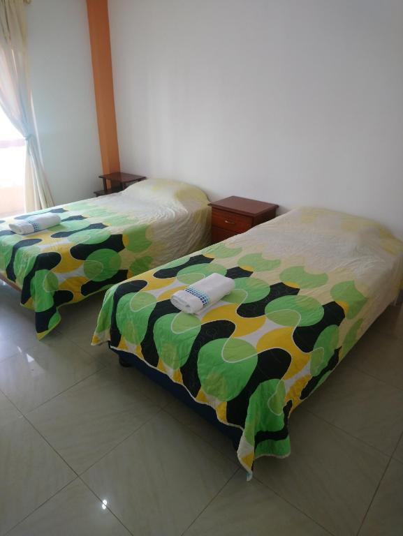 Postel nebo postele na pokoji v ubytování Hostal Terito