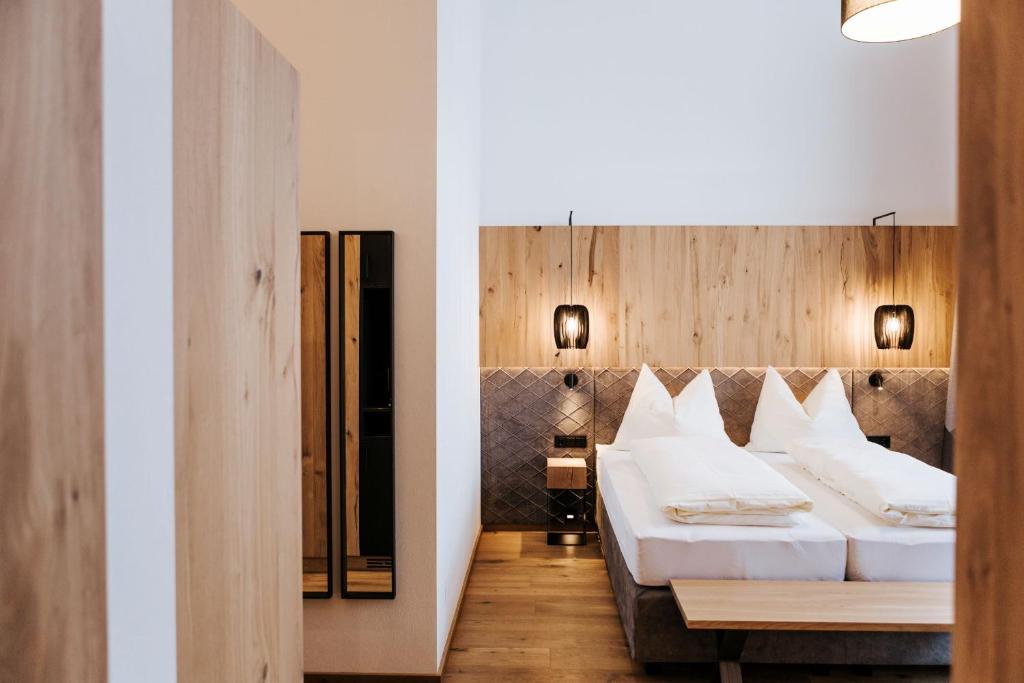 Postel nebo postele na pokoji v ubytování Hotel Thurnerhof