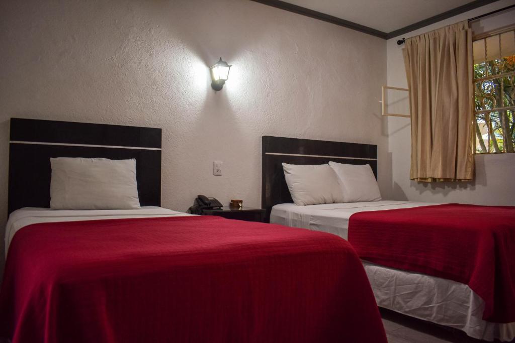 Postel nebo postele na pokoji v ubytování Hotel Santa Ana