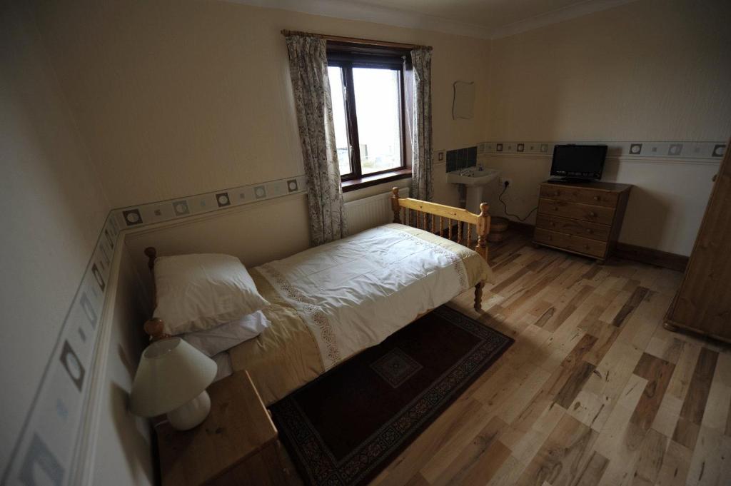 Voodi või voodid majutusasutuse Sandwick Bay Guest House toas