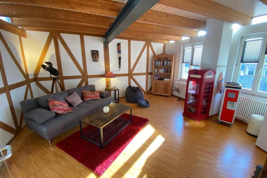 a living room with a couch and a gas station at CASA UNA im Herzen von Bad Kreuznach in Bad Kreuznach