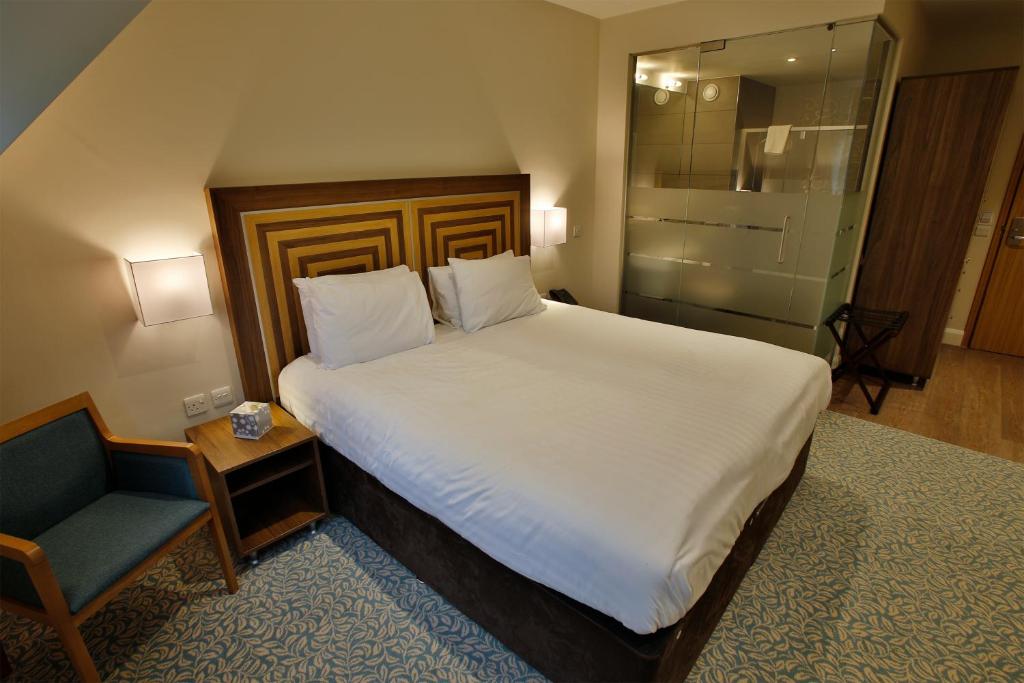 Postel nebo postele na pokoji v ubytování Quorn Grange Hotel