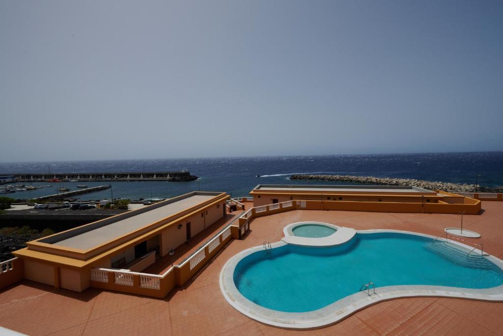a large swimming pool on the roof of a building at ABLANCAS - La Restinga in La Restinga