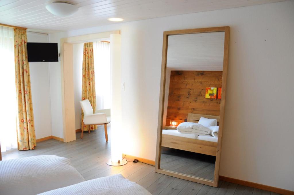Postel nebo postele na pokoji v ubytování Hotel Tenne
