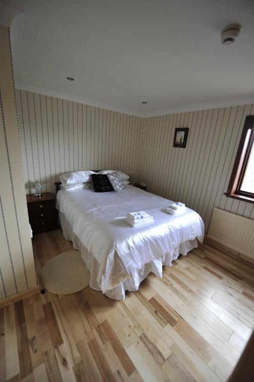 Voodi või voodid majutusasutuse Sandwick Bay Guest House toas