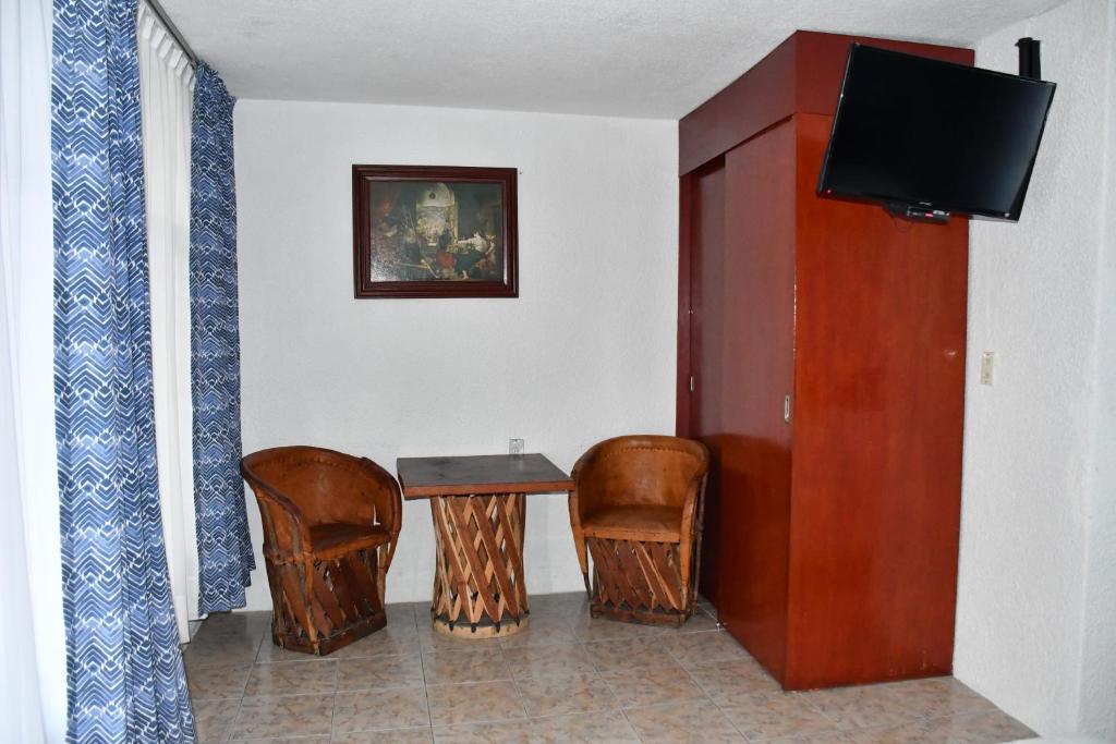 TV a/nebo společenská místnost v ubytování Hotel Posada Santa Fe