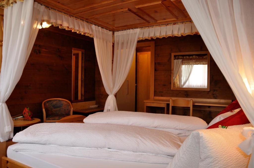 Postel nebo postele na pokoji v ubytování Hotel Tenne