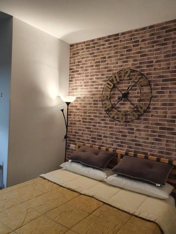 Postel nebo postele na pokoji v ubytování Hercules House - Il riposo degli Eroi