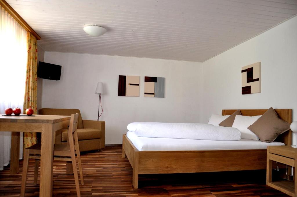 Postel nebo postele na pokoji v ubytování Hotel Tenne