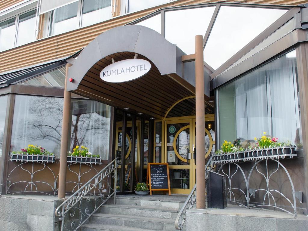 a building with a sign on the front of it at Kumla Hotel in Kumla