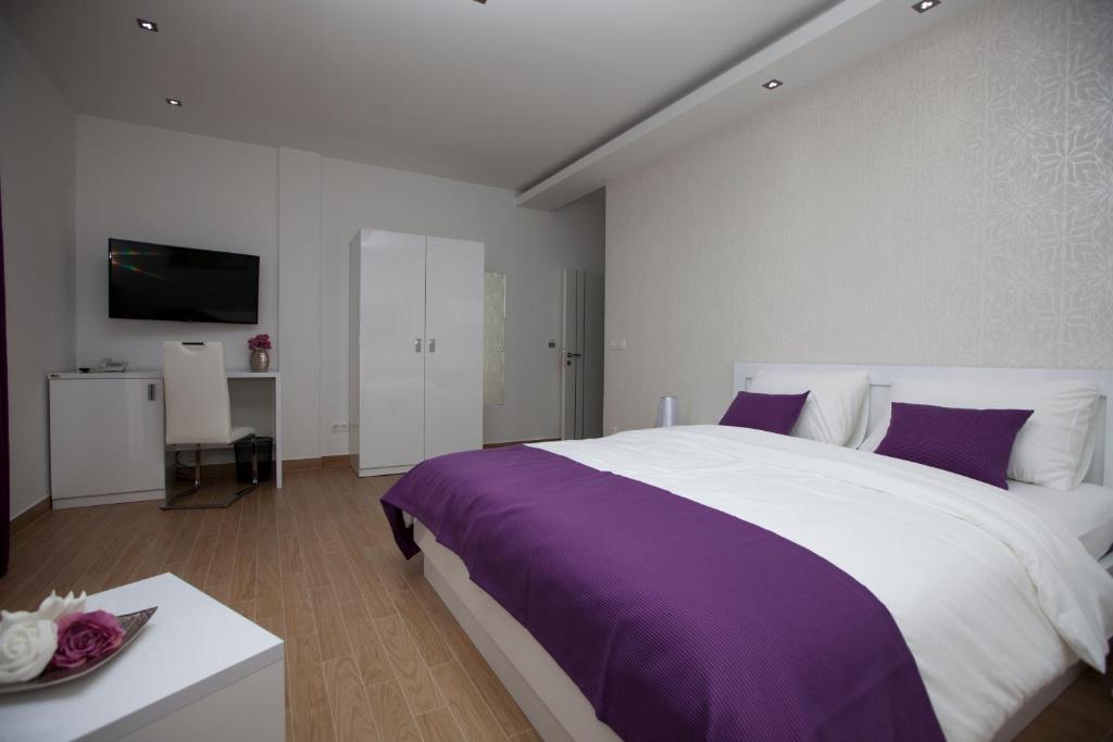 Postel nebo postele na pokoji v ubytování Rooms Ino