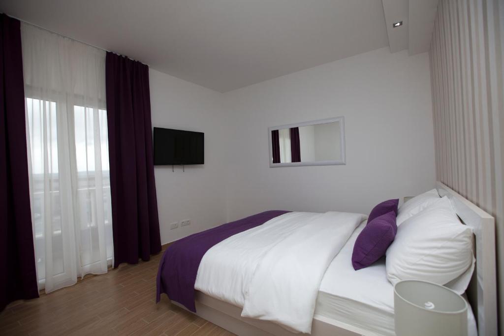 Postel nebo postele na pokoji v ubytování Rooms Ino
