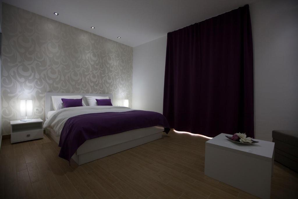 Postel nebo postele na pokoji v ubytování Rooms Ino