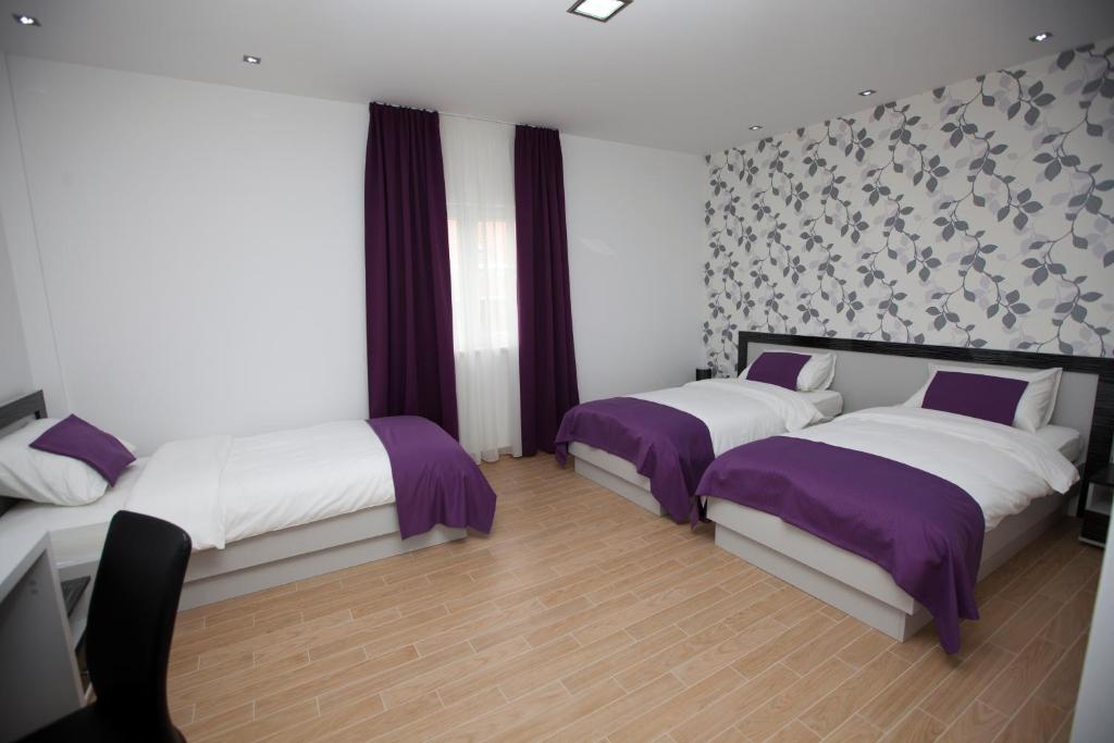 Postel nebo postele na pokoji v ubytování Rooms Ino