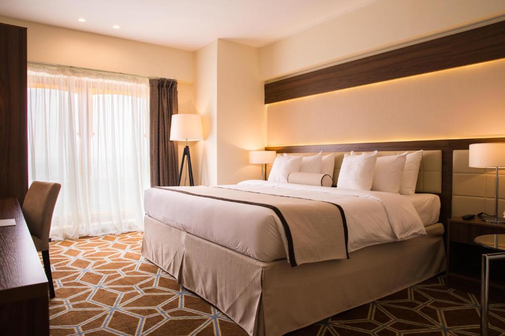Postel nebo postele na pokoji v ubytování Blue Coral Hotel