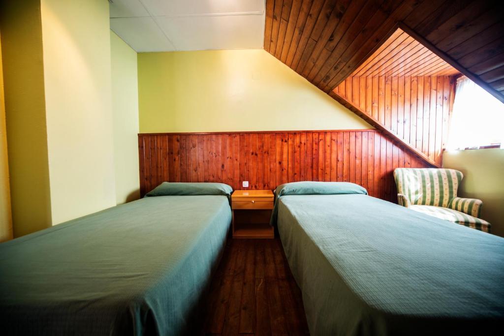 Postel nebo postele na pokoji v ubytování Hotel Hipic