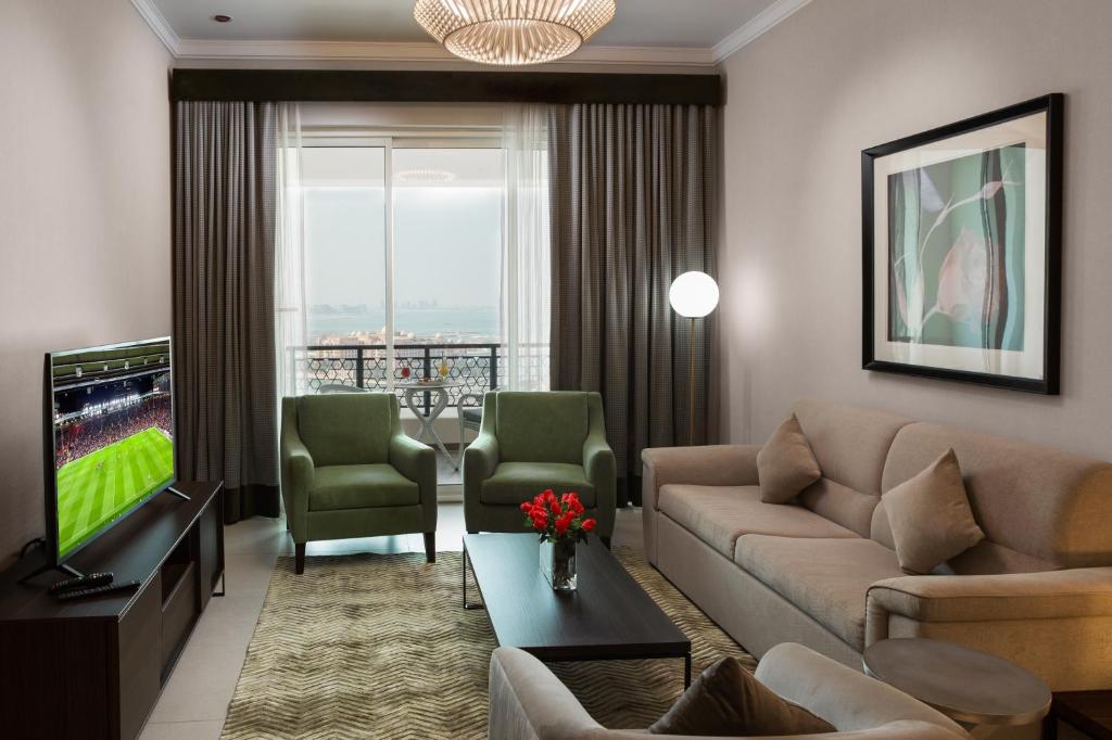 TV o dispositivi per l'intrattenimento presso Retaj Baywalk Residence