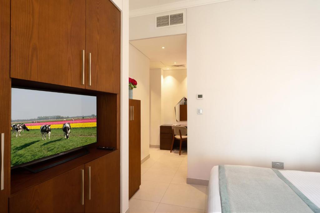 TV o dispositivi per l'intrattenimento presso Retaj Baywalk Residence