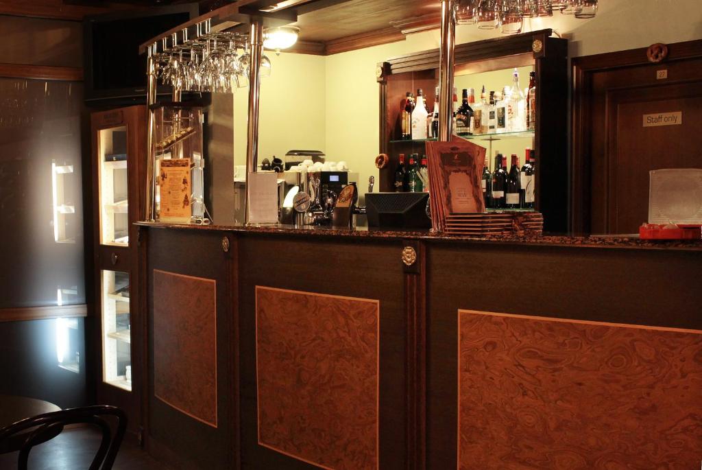 a bar in a restaurant with bottles of alcohol at Grand Peterhof Spa Hotel in Petergof