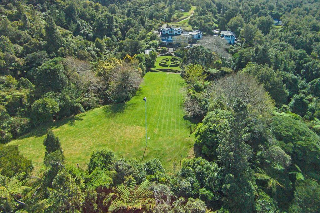 an aerial view of a house in the middle of a field at Woodroyd Estate holiday sanctuary in Island Bay