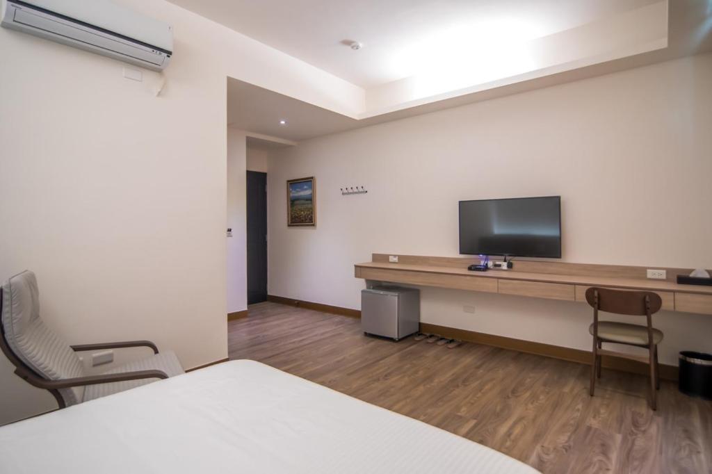 TV a/nebo společenská místnost v ubytování MuXia Fengqing Homestay