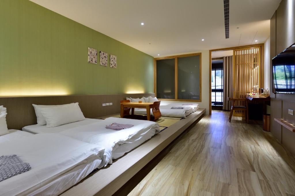 Postel nebo postele na pokoji v ubytování Shine Mood Resort Yuanli