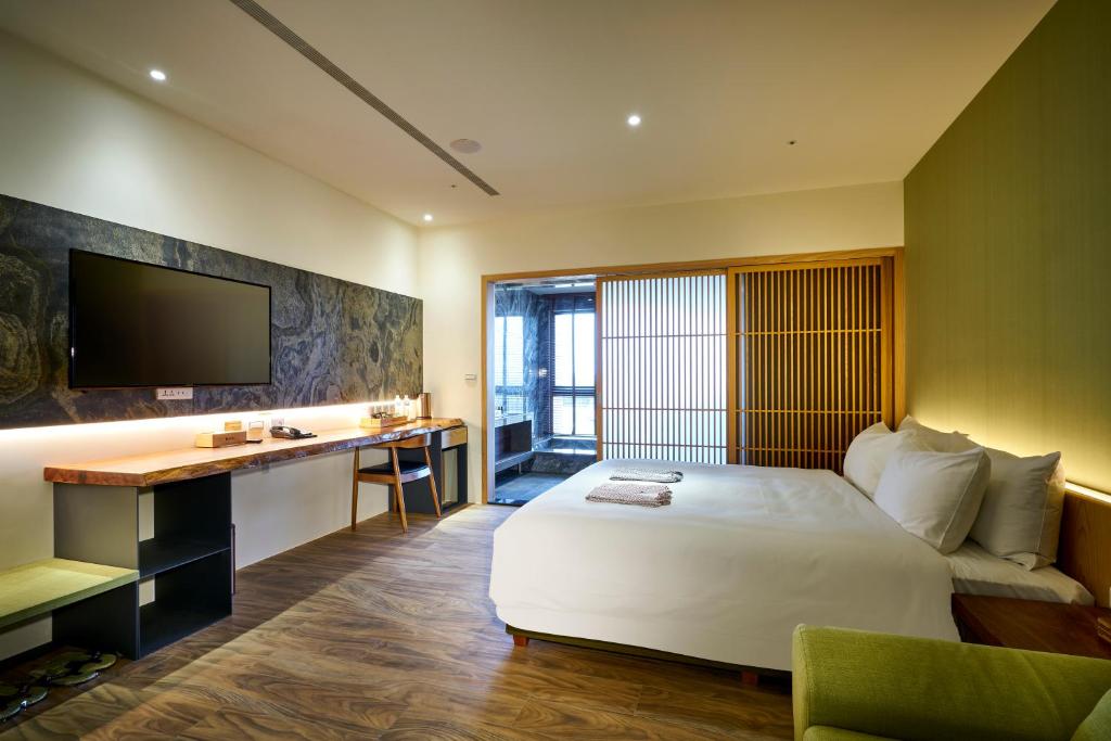 Postel nebo postele na pokoji v ubytování Shine Mood Resort Yuanli