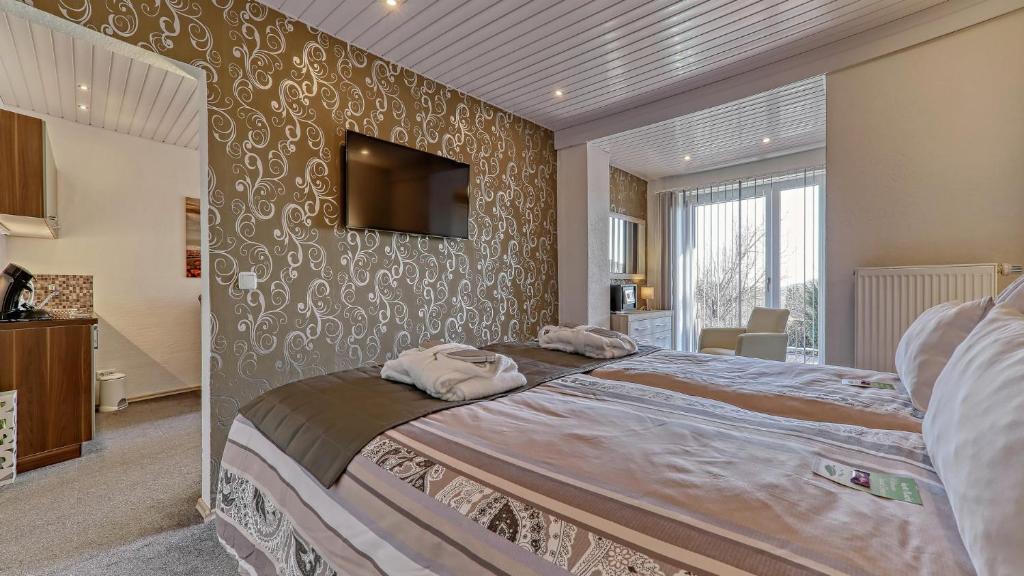 Postel nebo postele na pokoji v ubytování Suit' & Frühstück Zum Latschen - Adults Only