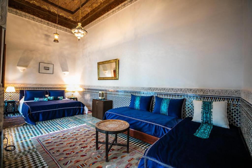 Postel nebo postele na pokoji v ubytování Riad Arabella