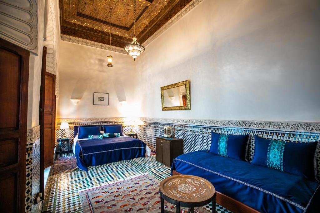 Postel nebo postele na pokoji v ubytování Riad Arabella