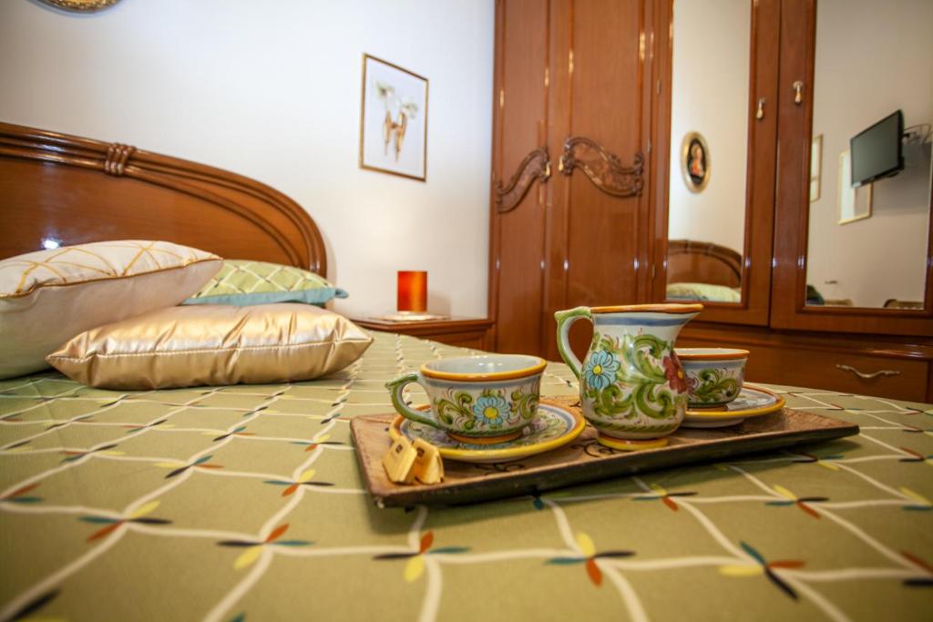 Łóżko lub łóżka w pokoju w obiekcie Casa RosaMaria