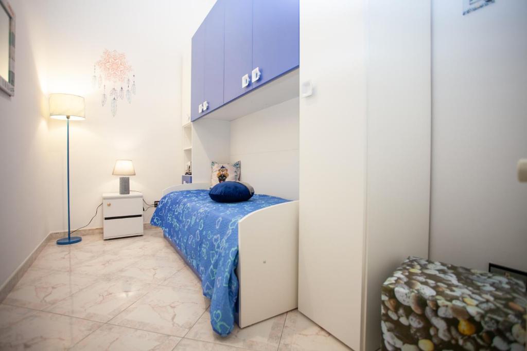 Łóżko lub łóżka w pokoju w obiekcie Casa RosaMaria