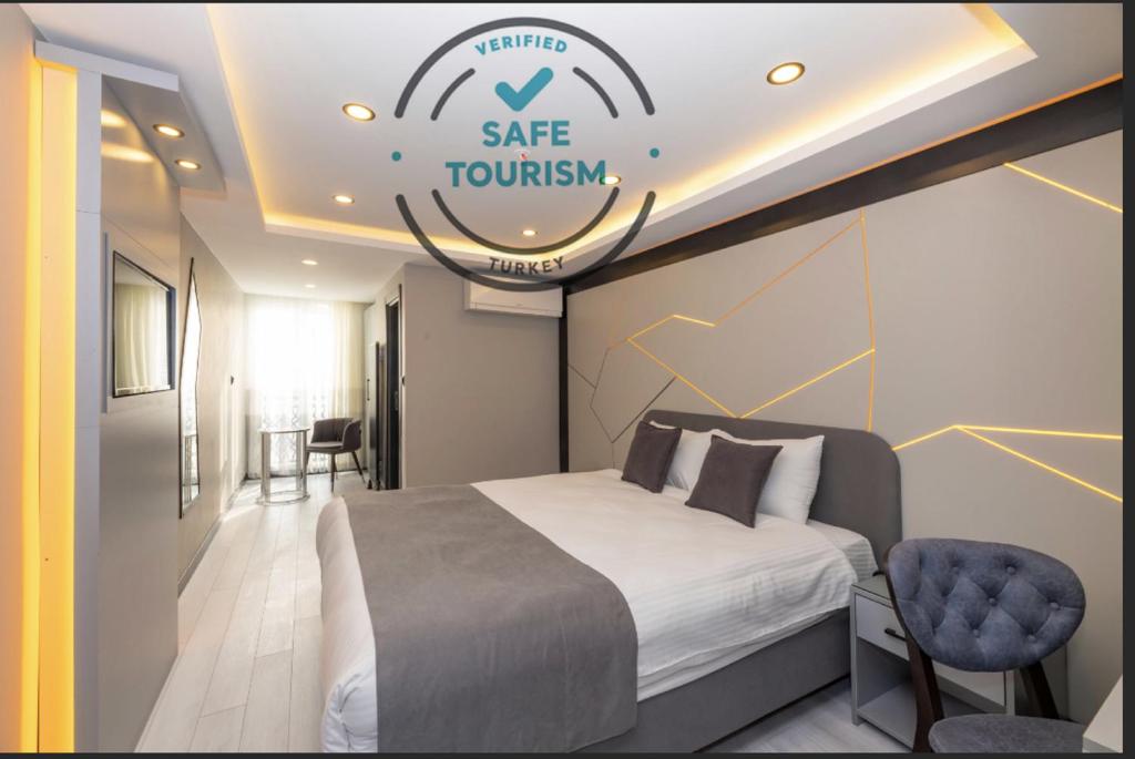 a hotel room with a bed and a sign that reads safe journey at White Corner Hotel in Istanbul