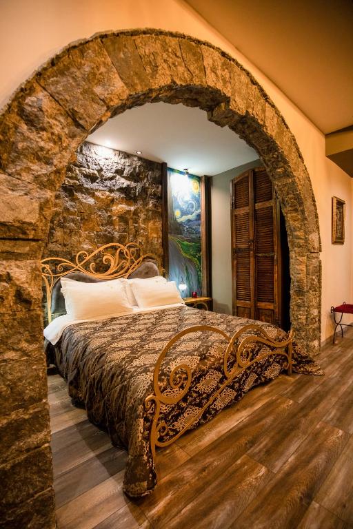 Postel nebo postele na pokoji v ubytování Vila Eden Boutique Hotel