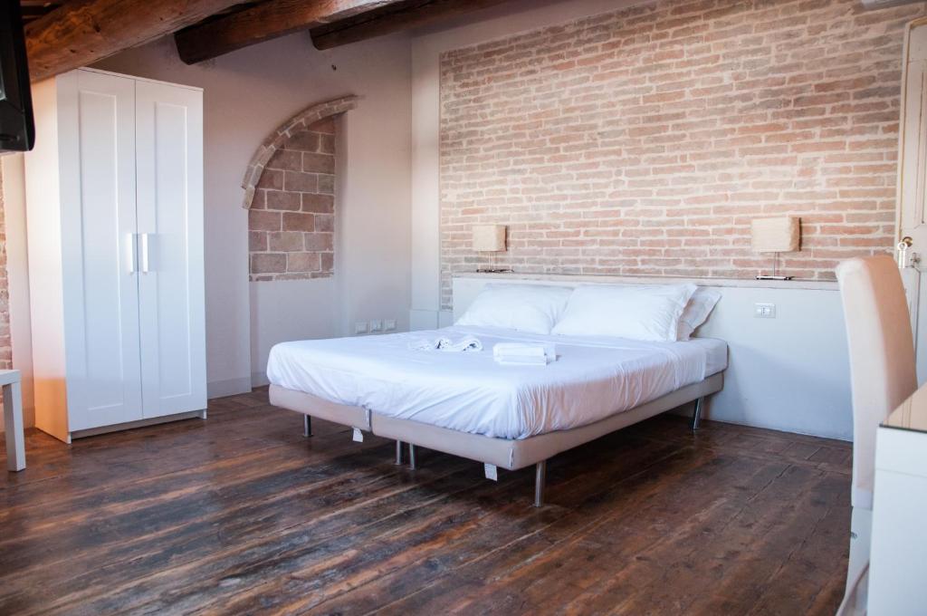 Postel nebo postele na pokoji v ubytování Relais Casetta56