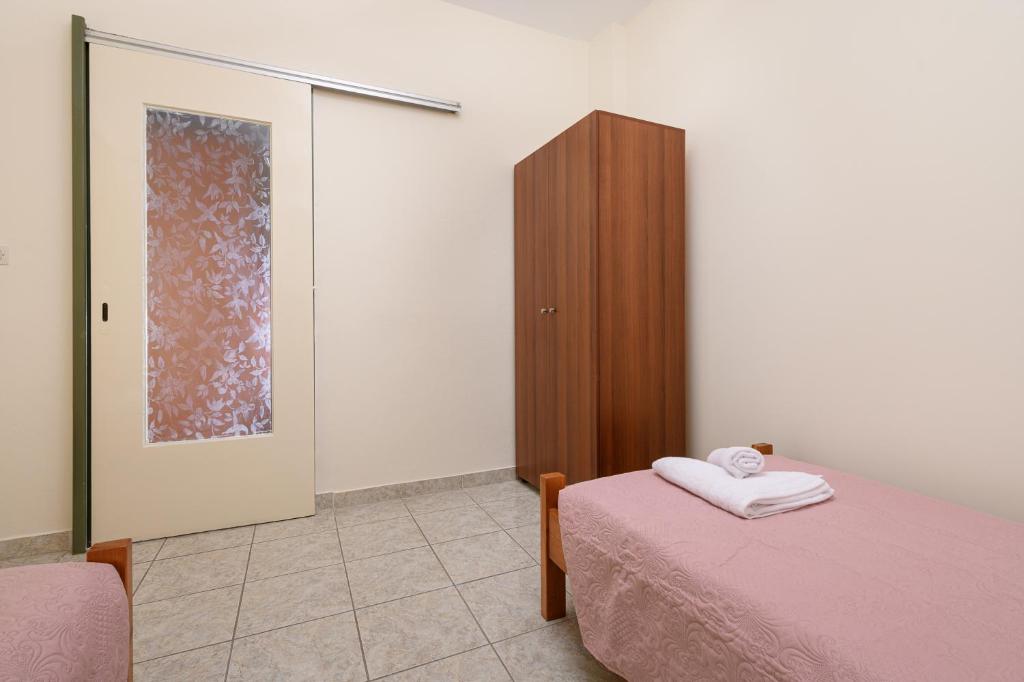 Posteľ alebo postele v izbe v ubytovaní Petrakis Afrathias garden house